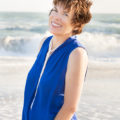 Maura Raffensperger enjoying a walk on the beach. Maura coaches business owners on how to increase profitability and time for play.